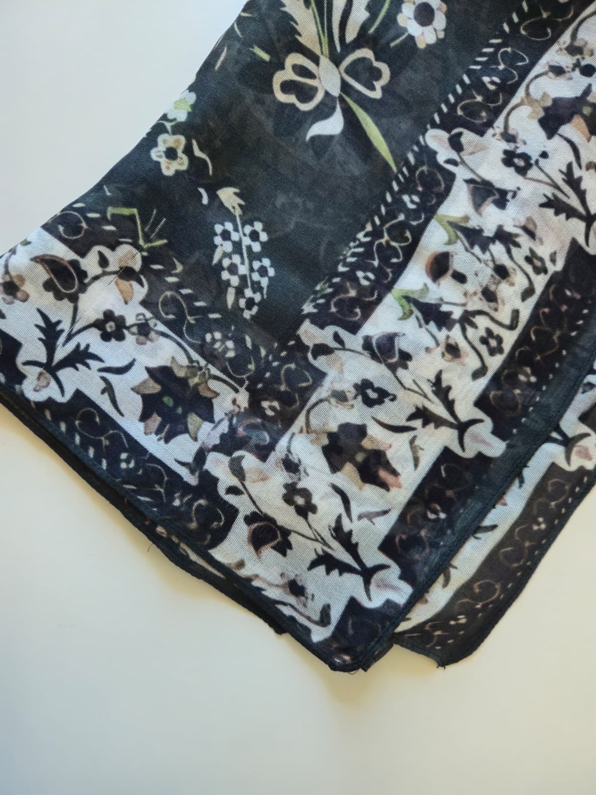 Black and white patterned modal hijab on a white background