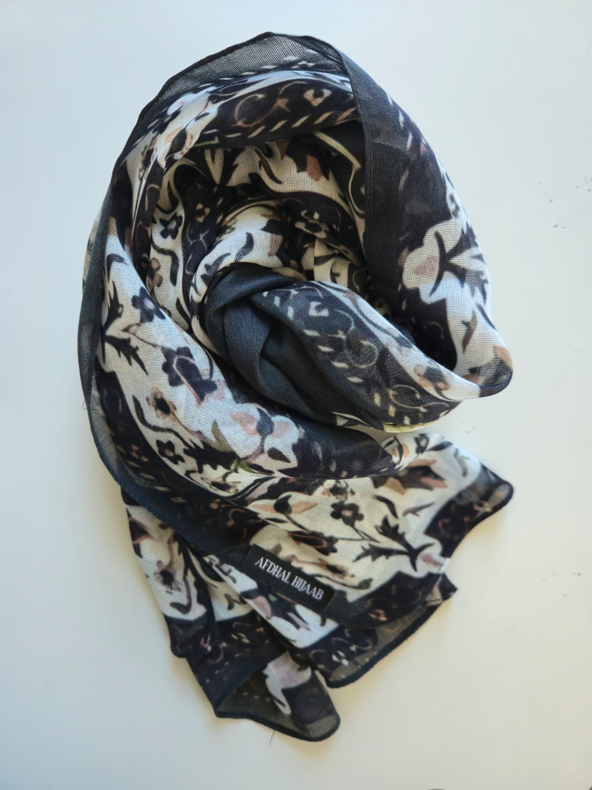 Floral patterned modal hijab on a white background